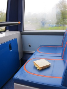 Bus seat with a potato crisp sandwich placed on it