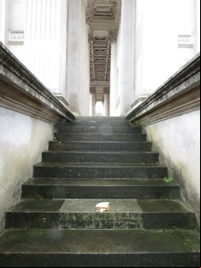 Crisp sandwich on wet steps in front of columns