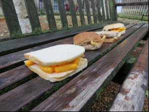 Four sandwiches on park bench, Wotsits sandwich at front