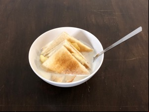 Potato crisps within crustless toast with milk