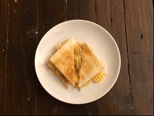 Overhead view of crinkle-cut crisps in toast