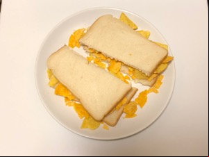 Doritos within and around white sliced bread