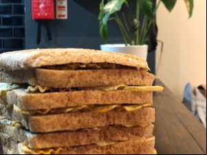 Top of brown loaf filled with crinkle-cut crisps