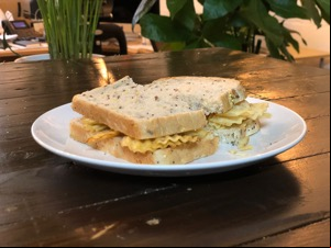 Crinkle-cut crisps in multigrain bread sliced in half