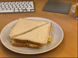White diagonally-cut crisp sandwich on a desk