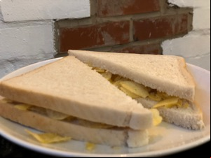 Close-up of diagonally-cut crisp sandwich