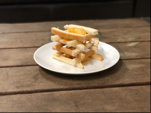 Lattice of bread crusts containing crinkle-cut crisps