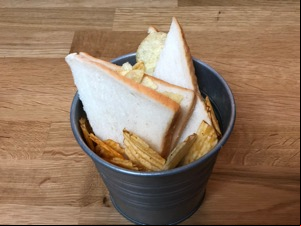 Crisp sandwich and loose crisps in metal bucket
