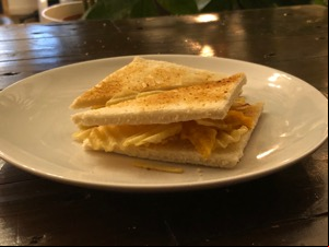 Crinkle-cut crisps between toasted white bread