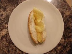 Finger roll filled with potato crisps viewed from above