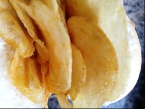 Extreme close up of white roll containing crisps