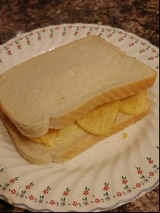 Close up of white crisp-filled sandwich