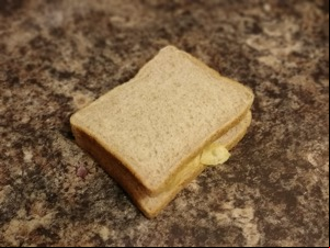 Brown crisp sandwich on a granite surface