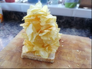 Loooads of crisps piled onto white bread