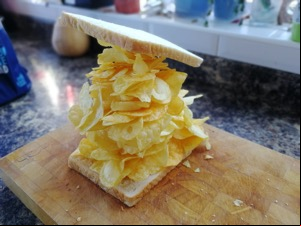 Massively overfilled crisp sandwich with precarious lid
