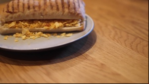 Turning to reveal a crushed crisp panini